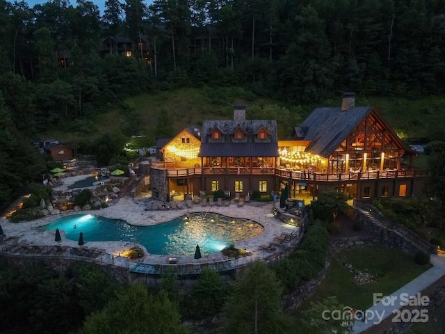 75 Indigo Bunting Ct, Tuckasegee, NC 28783 - swimming pool with a wooden deck and a patio area