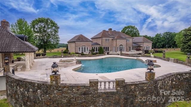 1100 Glen Oaks Dr, Hamptonville, NC 27020 - view of swimming pool featuring a patio, a pool with connected hot tub, and a gazebo
