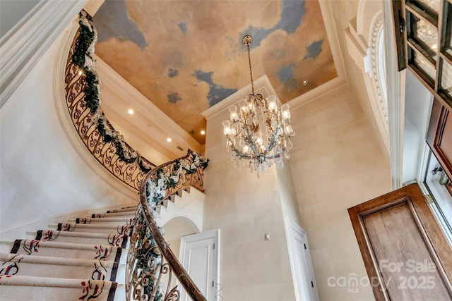 1100 Glen Oaks Dr, Hamptonville, NC 27020 - staircase with a high ceiling, a chandelier, crown molding, and recessed lighting