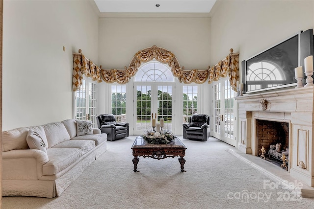 1100 Glen Oaks Dr, Hamptonville, NC 27020 - living room with carpet floors, a fireplace, a towering ceiling, and ornamental molding