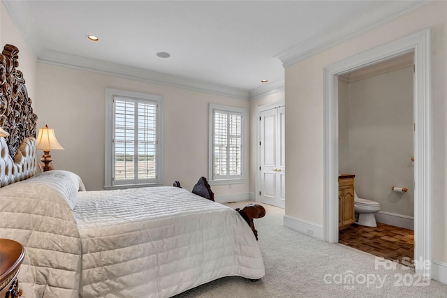 1100 Glen Oaks Dr, Hamptonville, NC 27020 - carpeted bedroom with multiple windows, baseboards, ensuite bath, ornamental molding, and recessed lighting