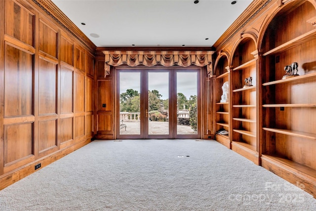 1100 Glen Oaks Dr, Hamptonville, NC 27020 - spare room with crown molding, built in features, carpet, and wooden walls