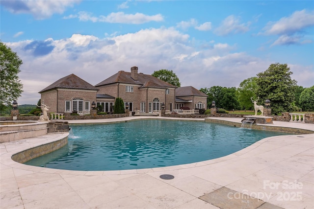 1100 Glen Oaks Dr, Hamptonville, NC 27020 - view of pool featuring a patio area and a pool with connected hot tub