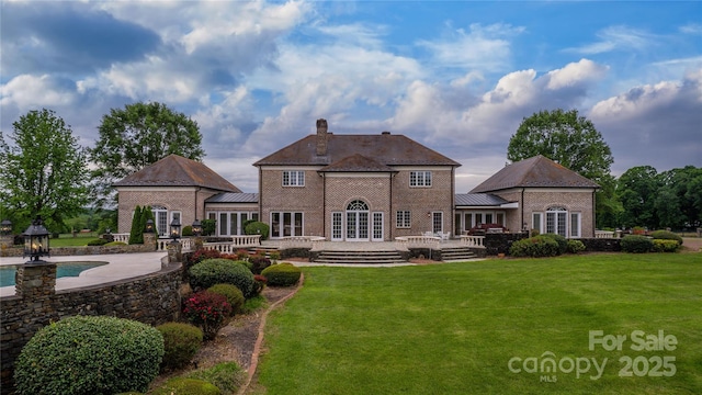 1100 Glen Oaks Dr, Hamptonville, NC 27020 - rear view of house with french doors, a yard, brick siding, and a deck