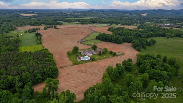 1100 Glen Oaks Dr, Hamptonville, NC 27020 - aerial view of property and surrounding area featuring rural landscape and a mountainous background