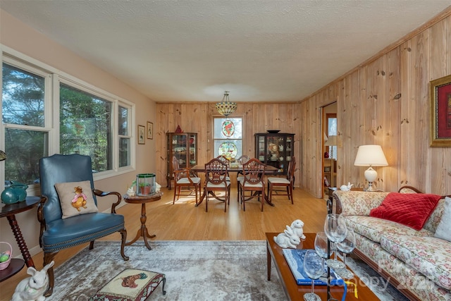 52 Oakhurst Rd, Arden, NC 28704 - living room featuring light wood-style floors and wooden walls