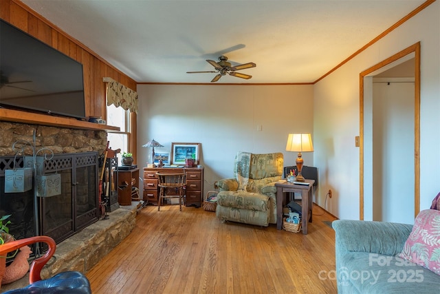 52 Oakhurst Rd, Arden, NC 28704 - living room with a ceiling fan, ornamental molding, a stone fireplace, and hardwood / wood-style floors