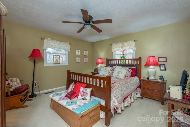 52 Oakhurst Rd, Arden, NC 28704 - bedroom with carpet flooring, multiple windows, a ceiling fan, and a textured ceiling