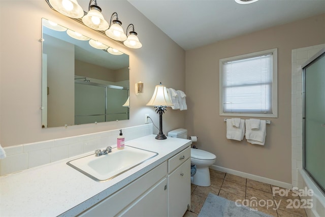 52 Oakhurst Rd, Arden, NC 28704 - full bathroom featuring vanity, toilet, tile patterned flooring, and baseboards