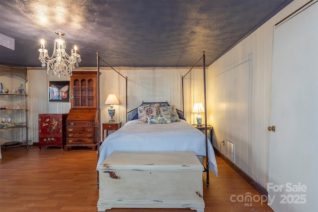 52 Oakhurst Rd, Arden, NC 28704 - bedroom featuring a chandelier and wood finished floors
