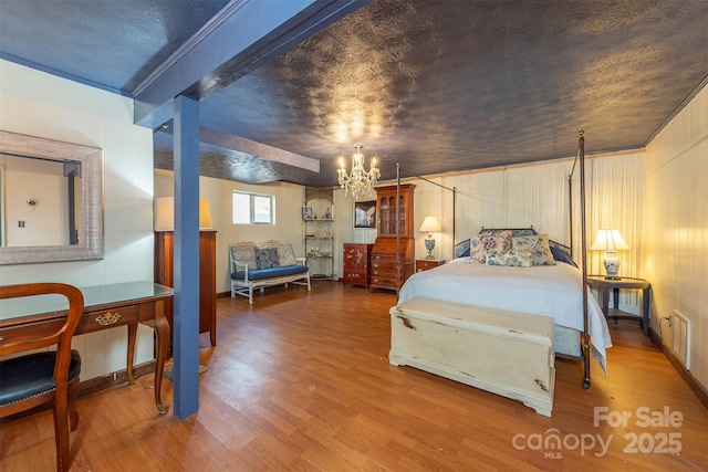 52 Oakhurst Rd, Arden, NC 28704 - bedroom with wood finished floors, a chandelier, and ornamental molding