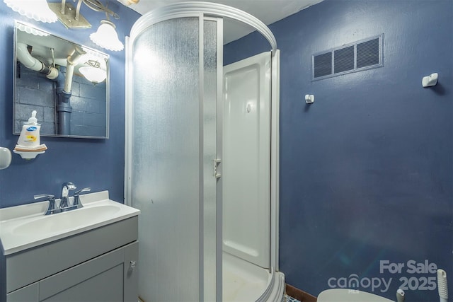 52 Oakhurst Rd, Arden, NC 28704 - bathroom with a shower stall, vanity, and toilet
