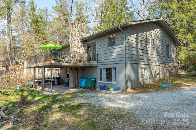 52 Oakhurst Rd, Arden, NC 28704 - rear view of house with a chimney and a deck