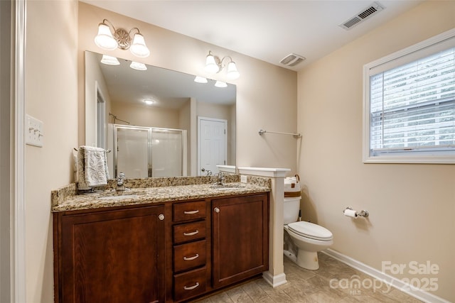 1206 Craig Ave, Lancaster, SC 29720 - bathroom with a shower stall, toilet, double vanity, and baseboards