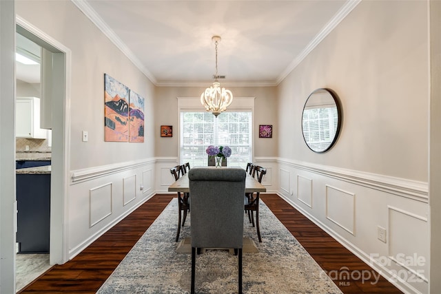 1206 Craig Ave, Lancaster, SC 29720 - dining room featuring a chandelier, dark wood-type flooring, ornamental molding, and wainscoting