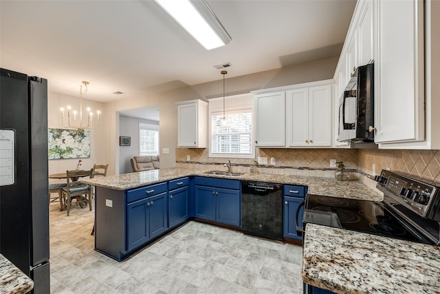 1206 Craig Ave, Lancaster, SC 29720 - kitchen featuring black appliances, a sink, blue cabinets, and a chandelier