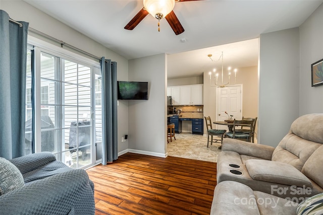 1206 Craig Ave, Lancaster, SC 29720 - living area with a ceiling fan, dark wood finished floors, a chandelier, and baseboards