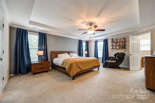 1206 Craig Ave, Lancaster, SC 29720 - carpeted bedroom featuring a raised ceiling, multiple windows, ornamental molding, ceiling fan, and baseboards