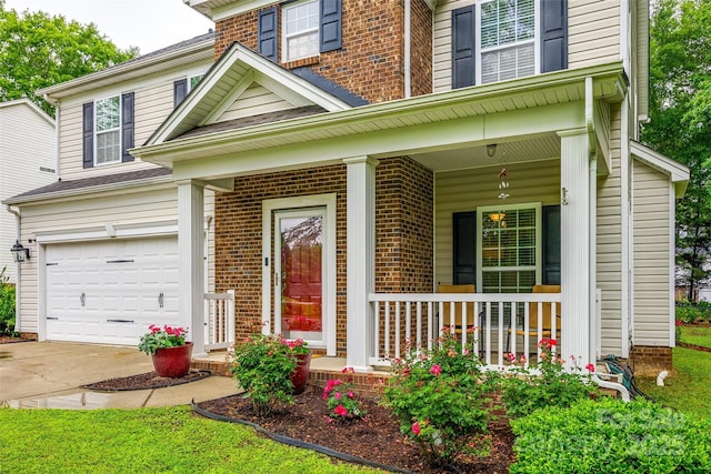 1206 Craig Ave, Lancaster, SC 29720 - view of front of home featuring a garage, covered porch, and brick siding