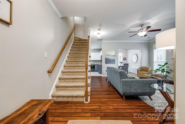 1206 Craig Ave, Lancaster, SC 29720 - living room featuring wood finished floors, crown molding, stairs, ceiling fan, and baseboards