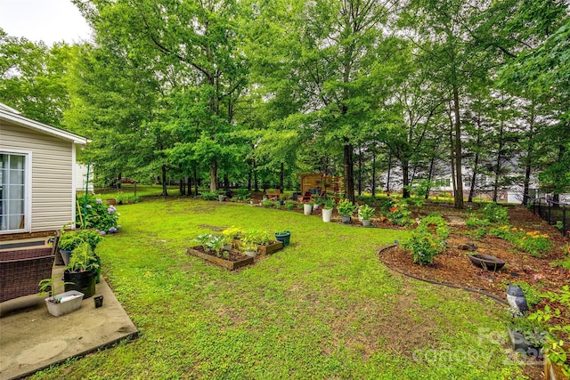 1206 Craig Ave, Lancaster, SC 29720 - view of yard featuring a garden and view of scattered trees