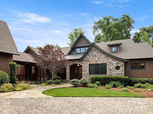 24 Deep Creek Trl, Arden, NC 28704 - view of front of home with stone siding, a front lawn, board and batten siding, and roof with shingles