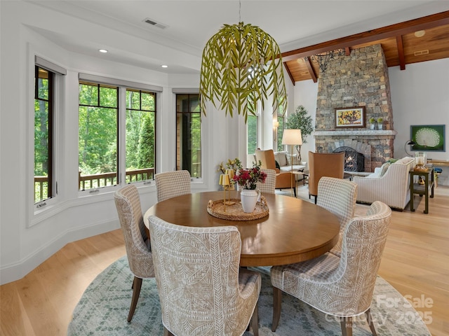 24 Deep Creek Trl, Arden, NC 28704 - dining space with wood finished floors, beam ceiling, a fireplace, and baseboards