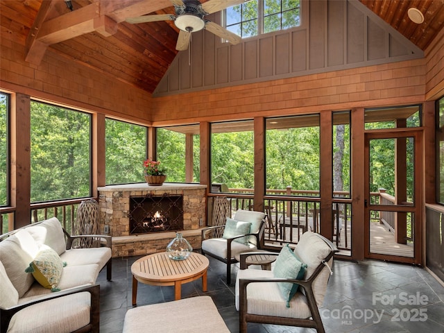 24 Deep Creek Trl, Arden, NC 28704 - sunroom featuring wooden ceiling, high vaulted ceiling, a ceiling fan, stone tile flooring, and an outdoor living space with a fireplace
