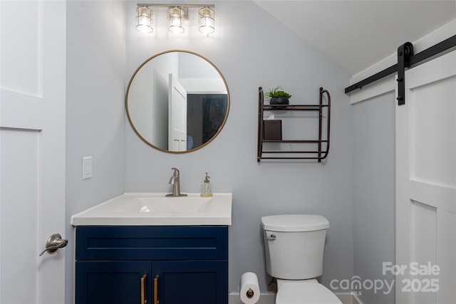 307 Hazel Mill Rd, Asheville, NC 28806 - bathroom featuring toilet, vanity, and vaulted ceiling