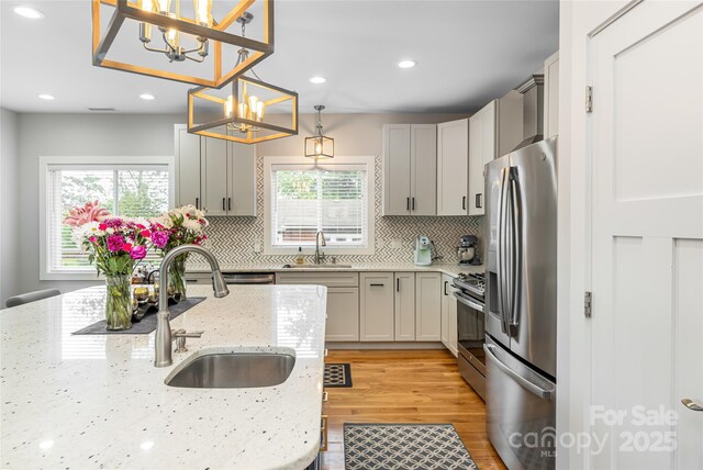 307 Hazel Mill Rd, Asheville, NC 28806 - kitchen with stainless steel appliances, a sink, a chandelier, healthy amount of natural light, and recessed lighting