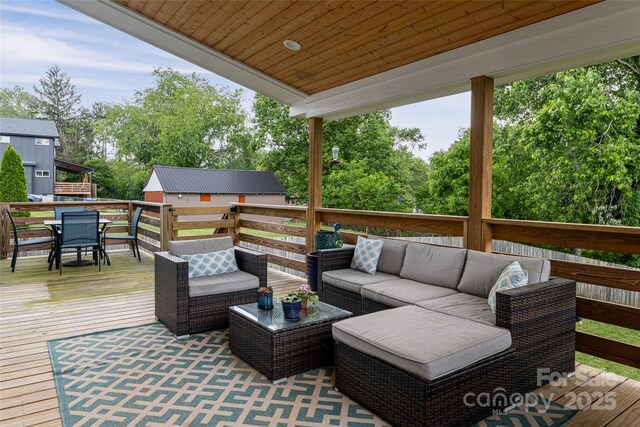 307 Hazel Mill Rd, Asheville, NC 28806 - deck featuring an outdoor living space, outdoor dining space, and view of scattered trees