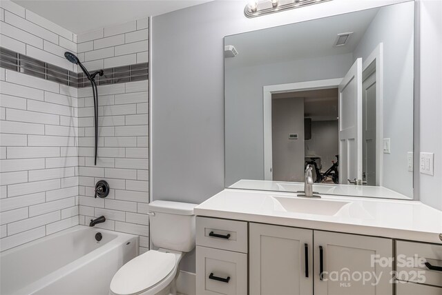 307 Hazel Mill Rd, Asheville, NC 28806 - bathroom with toilet, vanity, and bathing tub / shower combination