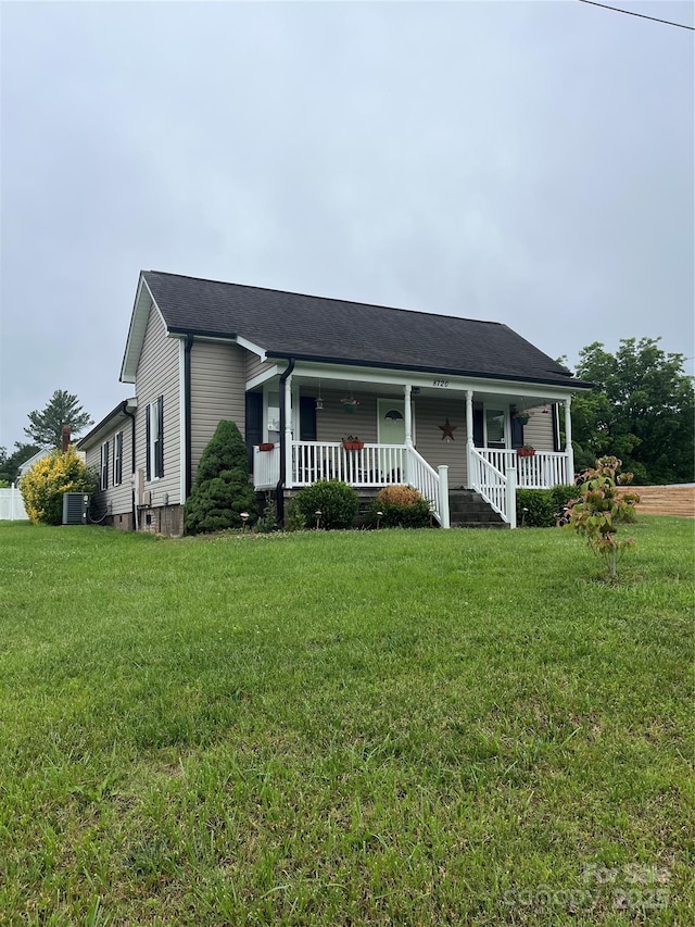 8720 Lee St, Mount Pleasant, NC 28124 - view of front of house with covered porch and a front lawn