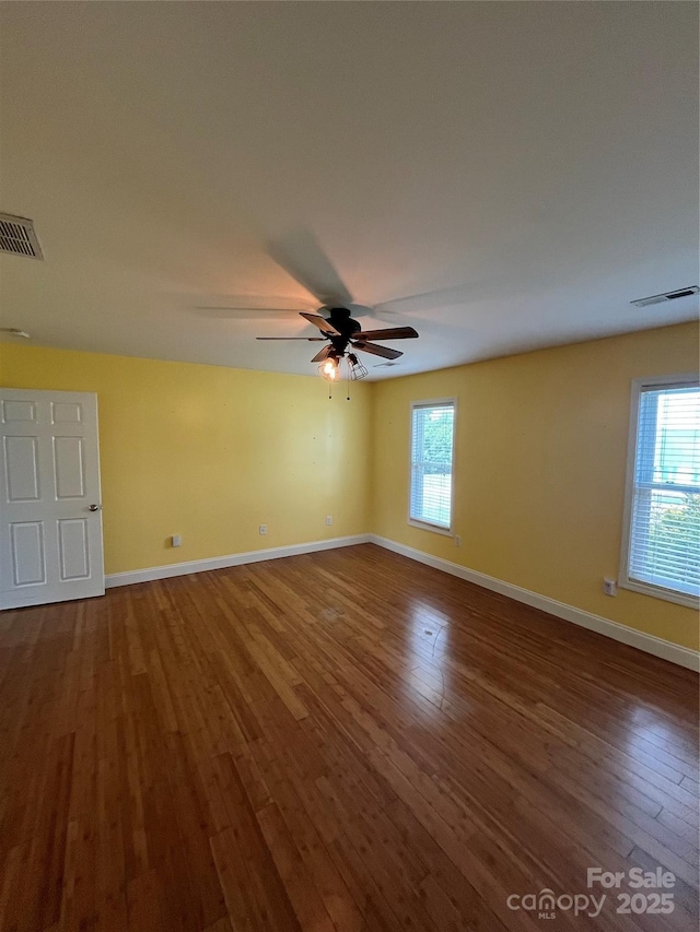 8720 Lee St, Mount Pleasant, NC 28124 - spare room with dark wood-type flooring, healthy amount of natural light, and a ceiling fan
