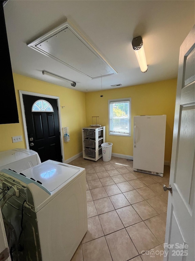 8720 Lee St, Mount Pleasant, NC 28124 - washroom with attic access, washer and clothes dryer, and light tile patterned floors