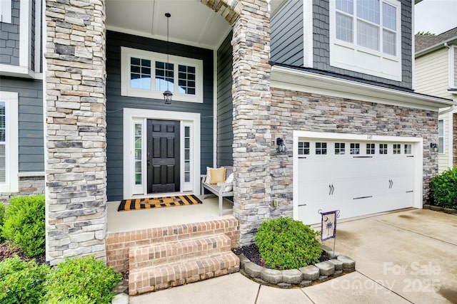 645 Brookhaven Dr, Fort Mill, SC 29708 - property entrance featuring an attached garage, stone siding, and driveway