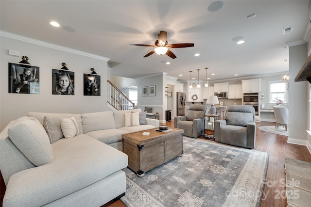 645 Brookhaven Dr, Fort Mill, SC 29708 - living area with ornamental molding, wood finished floors, ceiling fan, stairs, and baseboards