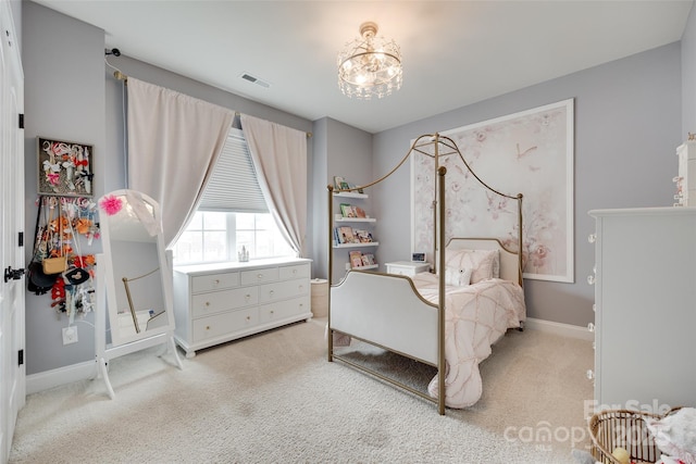 645 Brookhaven Dr, Fort Mill, SC 29708 - bedroom with light colored carpet, a chandelier, and baseboards