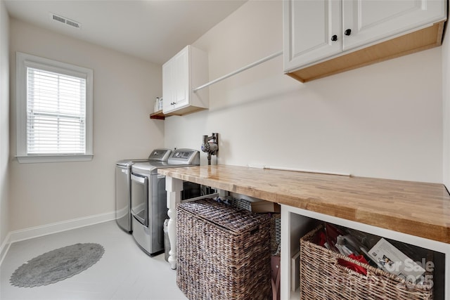 645 Brookhaven Dr, Fort Mill, SC 29708 - laundry area featuring cabinet space, independent washer and dryer, and baseboards