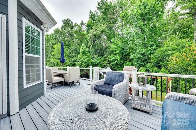 645 Brookhaven Dr, Fort Mill, SC 29708 - deck with outdoor dining area and view of wooded area