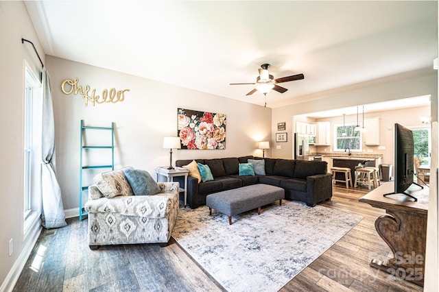 2045 13th St NE Unit 3, Hickory, NC 28601 - living area with a ceiling fan, dark wood finished floors, healthy amount of natural light, and baseboards