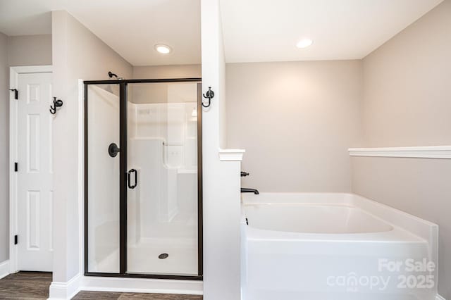 2045 13th St NE Unit 3, Hickory, NC 28601 - full bathroom with a stall shower, a bath, wood finished floors, baseboards, and recessed lighting