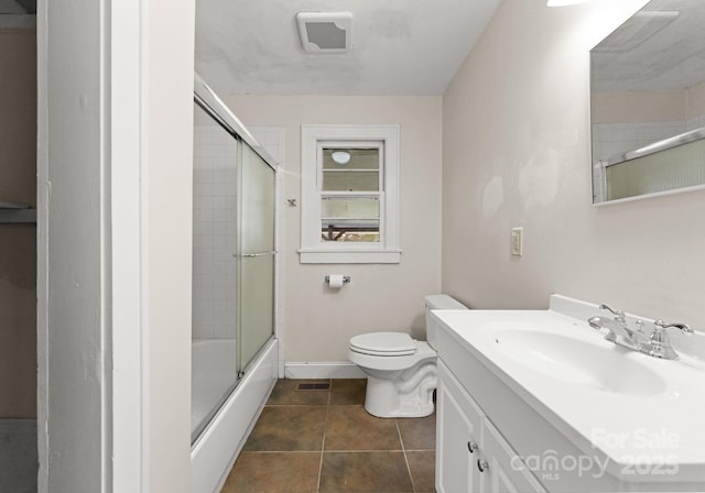 5170 Woodleaf Rd, Salisbury, NC 28147 - bathroom with vanity, toilet, shower / bath combination with glass door, baseboards, and tile patterned floors