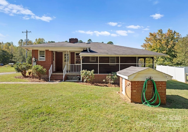 5170 Woodleaf Rd, Salisbury, NC 28147 - view of front of house with a sunroom, brick siding, and a chimney