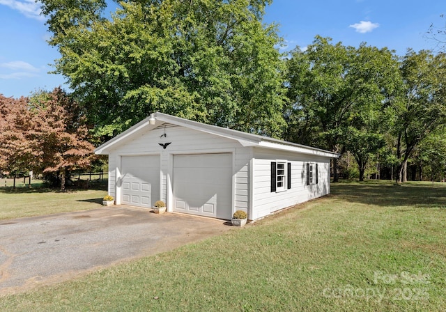5170 Woodleaf Rd, Salisbury, NC 28147 - detached garage featuring view of wooded area