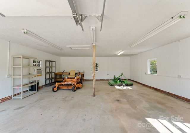5170 Woodleaf Rd, Salisbury, NC 28147 - garage featuring baseboards
