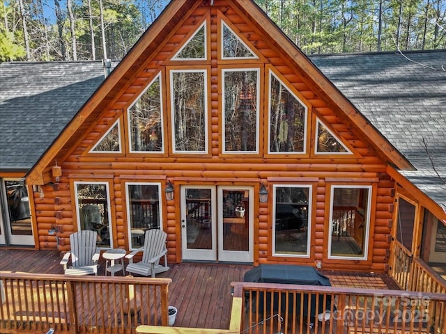 650 Mcdowell Rd, Columbus, NC 28722 - rear view of house featuring a shingled roof, a wooden deck, and log siding