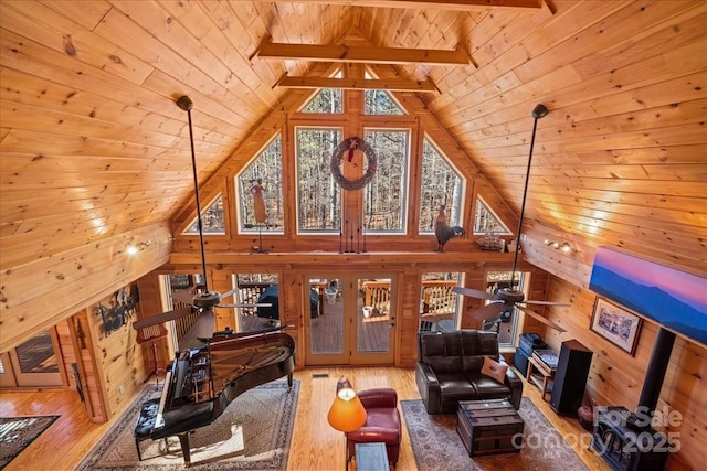 650 Mcdowell Rd, Columbus, NC 28722 - living room featuring wood ceiling with exposed beams, hardwood / wood-style flooring, french doors, ceiling fan, and wooden walls
