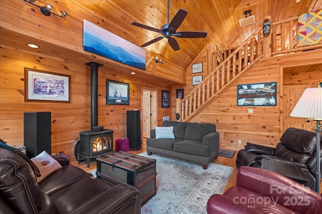 650 Mcdowell Rd, Columbus, NC 28722 - living room featuring wooden ceiling, stairway, a wood stove, a ceiling fan, and wood finished floors