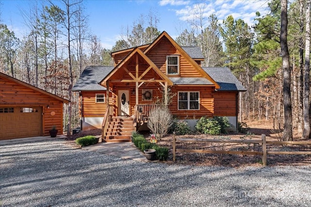 650 Mcdowell Rd, Columbus, NC 28722 - log-style house with log exterior, roof with shingles, driveway, and covered porch